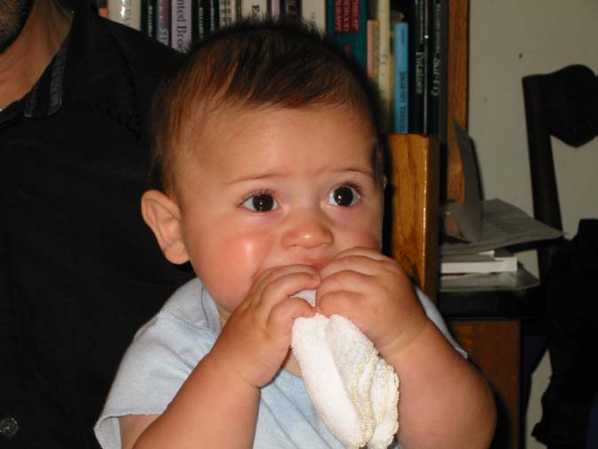 Pre-teething on frozen washcloth -- 6/22/02