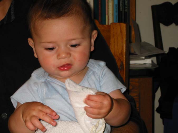 Pre-teething on frozen washcloth -- 6/22/02